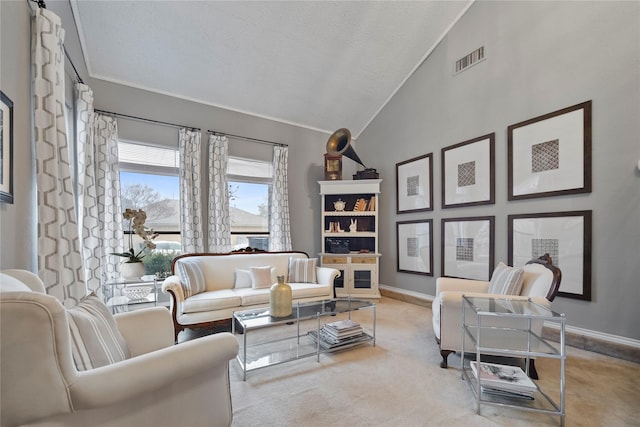 living room featuring light carpet and vaulted ceiling