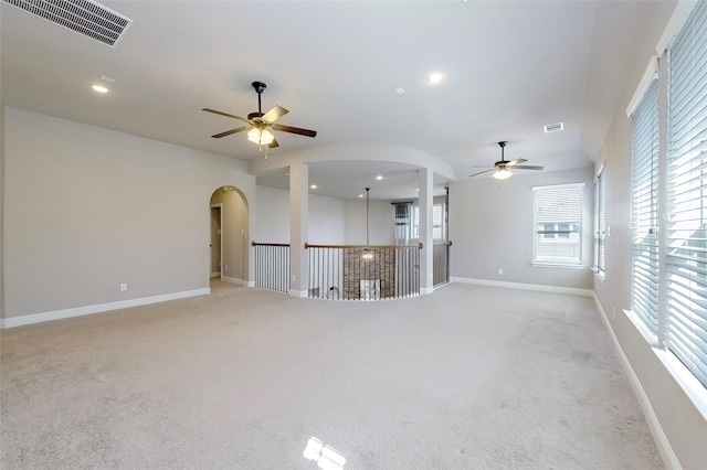 carpeted empty room featuring ceiling fan