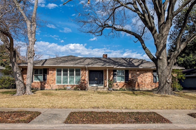 single story home featuring a front yard