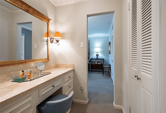 bathroom with crown molding and vanity