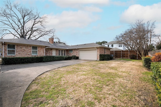 ranch-style house with a garage and a front yard