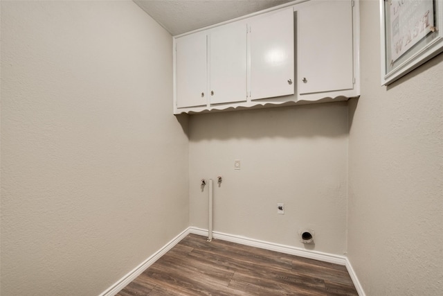 laundry room with cabinets, hookup for a washing machine, hookup for an electric dryer, and dark hardwood / wood-style flooring