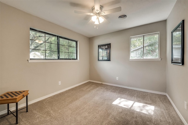 unfurnished room featuring carpet flooring and ceiling fan