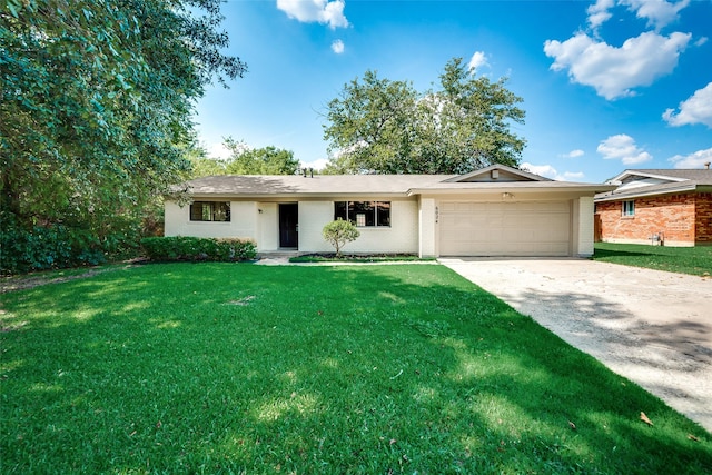 ranch-style house featuring a garage and a front yard