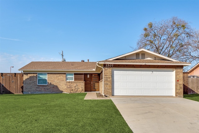 single story home with a garage and a front lawn