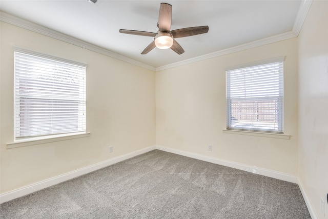 empty room with carpet floors, ornamental molding, and ceiling fan