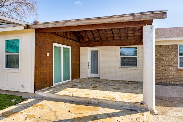 doorway to property featuring a patio area