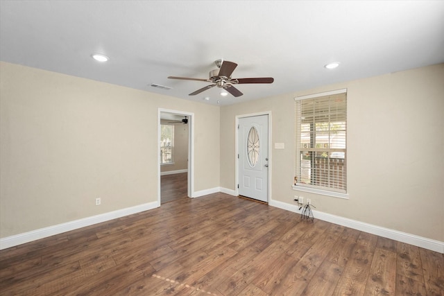 entrance foyer featuring dark hardwood / wood-style flooring, a wealth of natural light, and ceiling fan