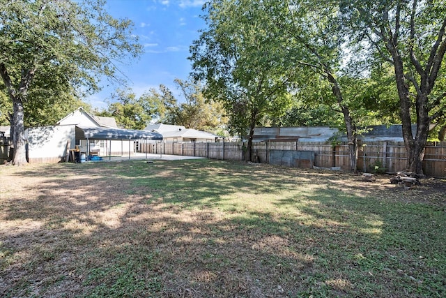 view of yard with a carport