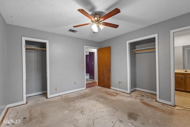 unfurnished bedroom featuring ceiling fan and a textured ceiling