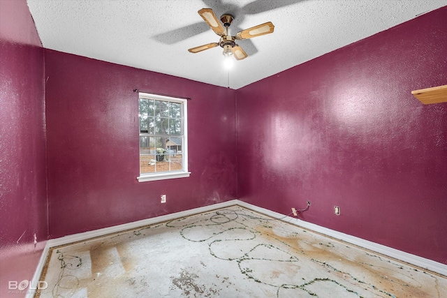 empty room featuring ceiling fan and a textured ceiling