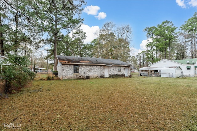 back of house with a yard