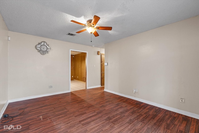 unfurnished room featuring ceiling fan, hardwood / wood-style flooring, and a textured ceiling