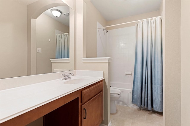 full bathroom with vanity, shower / bathtub combination with curtain, tile patterned floors, and toilet