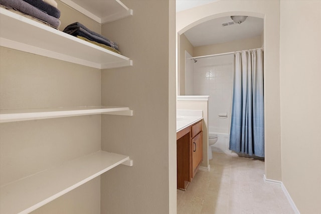 full bathroom featuring vanity, toilet, and shower / bathtub combination with curtain