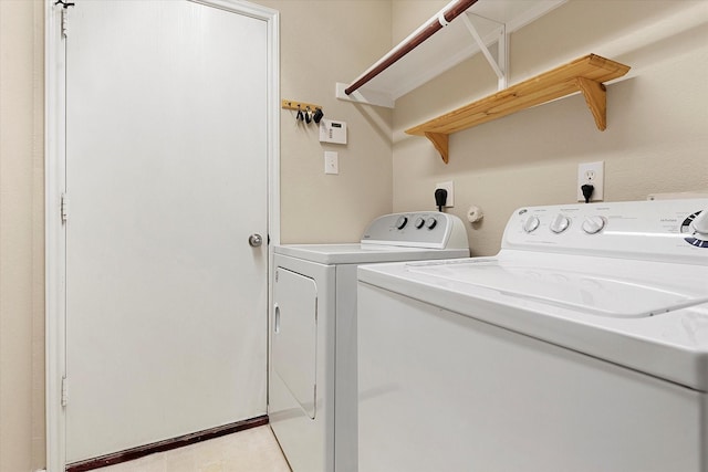 laundry area with independent washer and dryer