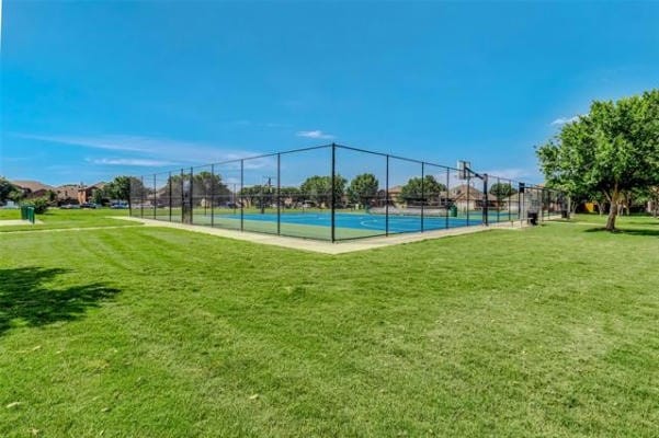 exterior space featuring a yard and tennis court