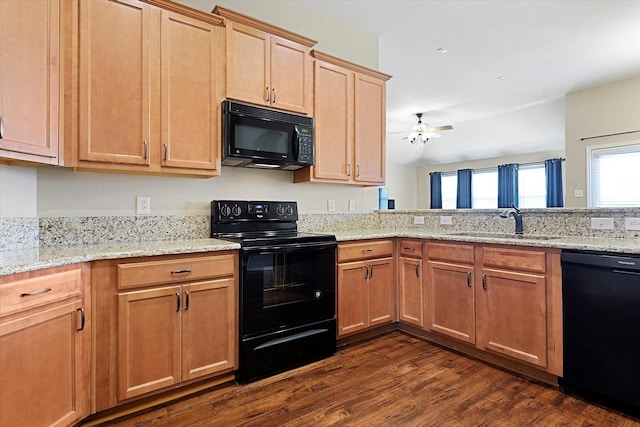 kitchen with sink, light stone counters, dark hardwood / wood-style floors, ceiling fan, and black appliances