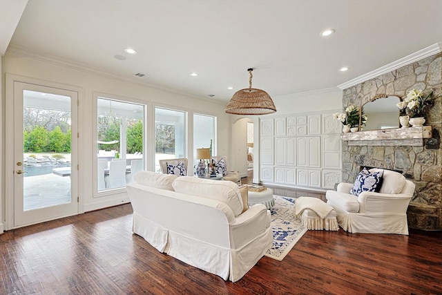 living room featuring ornamental molding and dark wood-type flooring