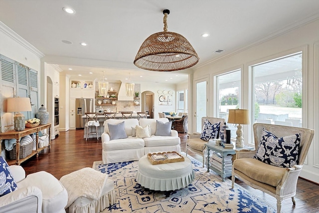 living room with ornamental molding and dark hardwood / wood-style flooring