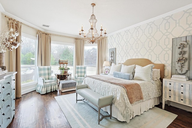 bedroom with ornamental molding, dark hardwood / wood-style floors, and a notable chandelier