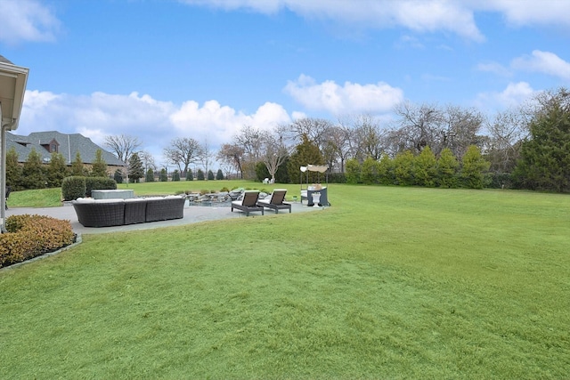 view of yard featuring an outdoor living space and a patio