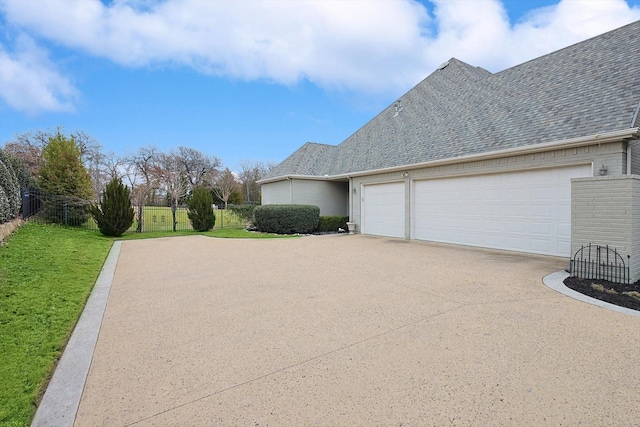 view of side of home with a garage