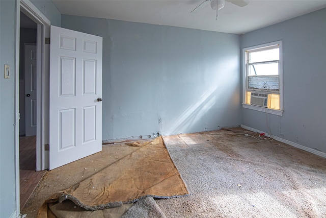 empty room featuring cooling unit and ceiling fan