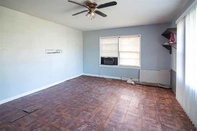 unfurnished room featuring dark parquet flooring, cooling unit, and ceiling fan