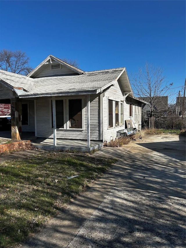 view of property exterior with covered porch