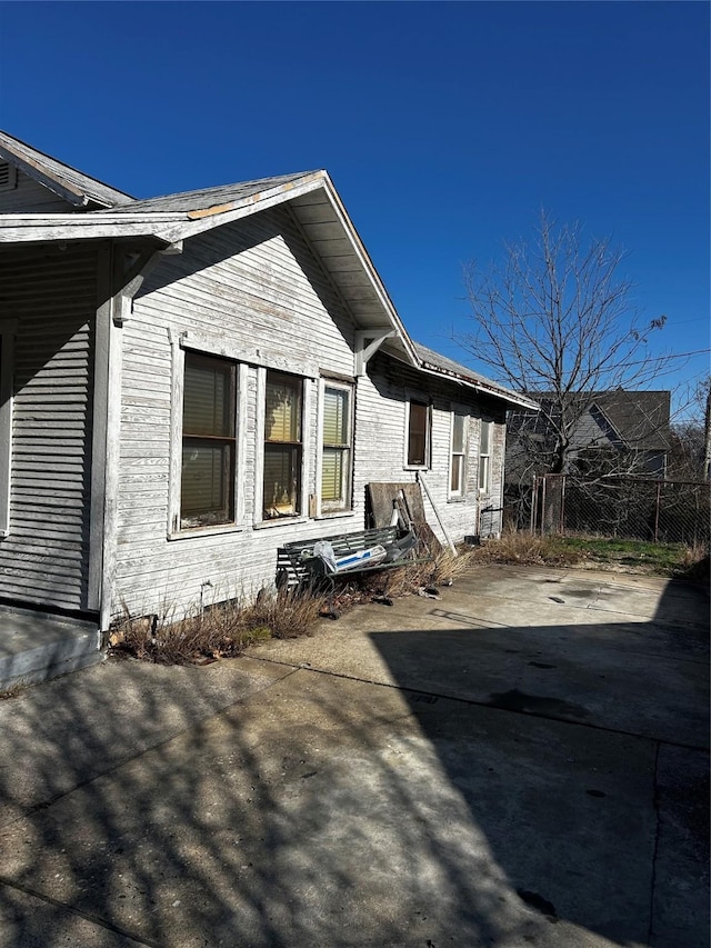 rear view of property featuring a patio area