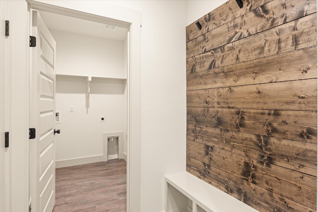 laundry area featuring hookup for an electric dryer and hardwood / wood-style floors