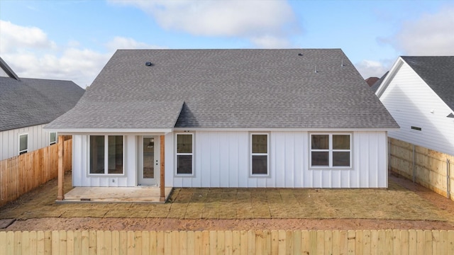 back of house with a patio