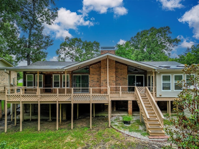 back of house with a wooden deck