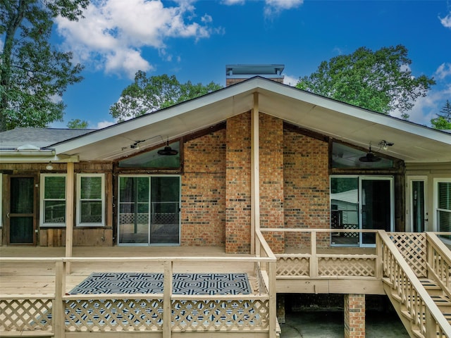 rear view of house featuring ceiling fan