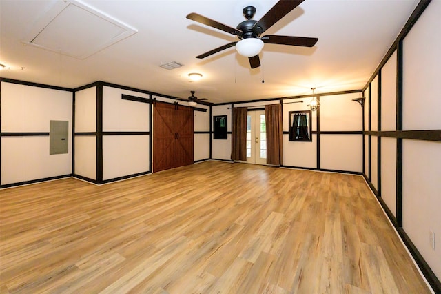 unfurnished room with french doors, ceiling fan, electric panel, and light hardwood / wood-style floors