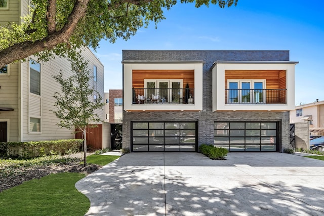 modern home with a garage and a balcony