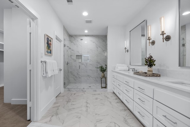 bathroom featuring an enclosed shower and vanity