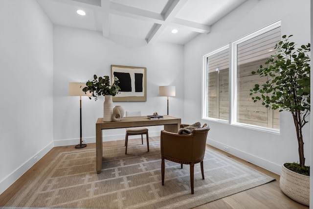 office featuring coffered ceiling, hardwood / wood-style floors, and beam ceiling