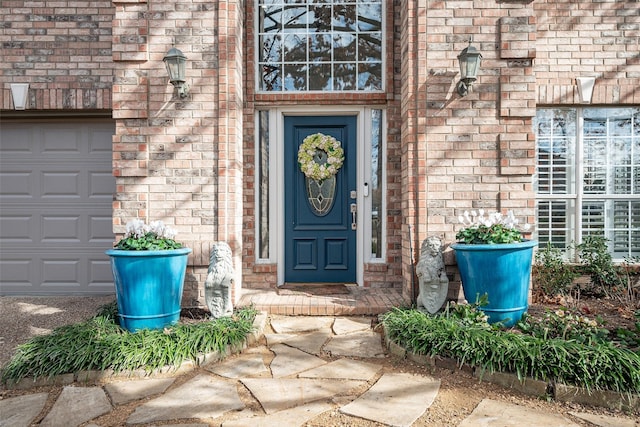 view of exterior entry with a garage