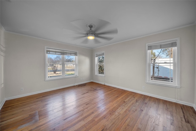 unfurnished room with ceiling fan, ornamental molding, and wood-type flooring