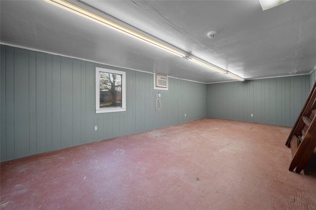 basement with a wall mounted air conditioner