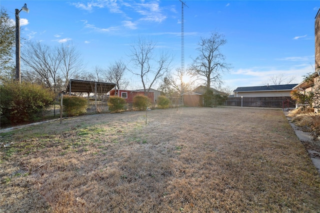 view of yard with a storage unit