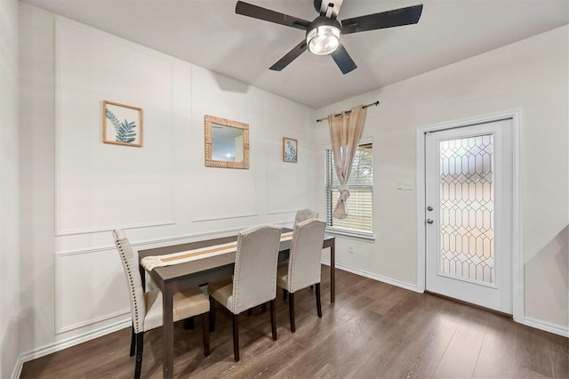 dining room with dark wood-type flooring and ceiling fan