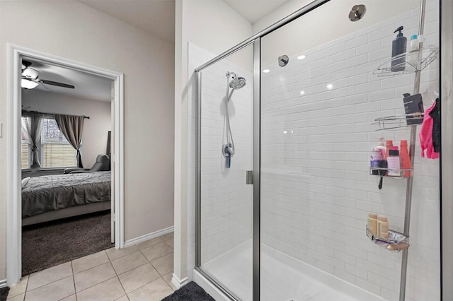 bathroom featuring tile patterned floors, ceiling fan, and walk in shower