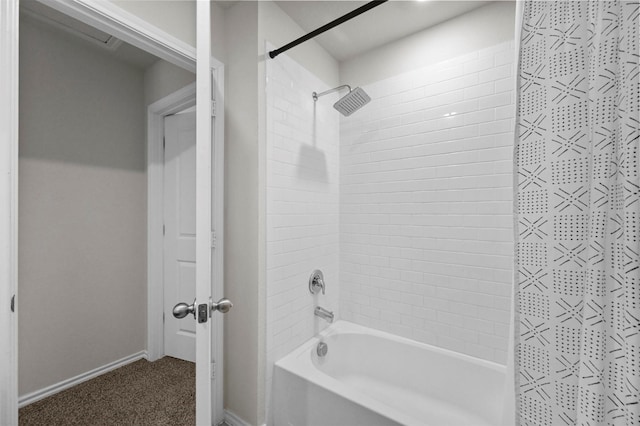 bathroom with shower / bath combination with curtain