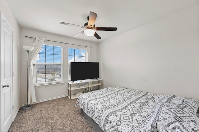 bedroom featuring ceiling fan and carpet