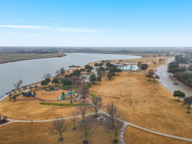 birds eye view of property with a water view