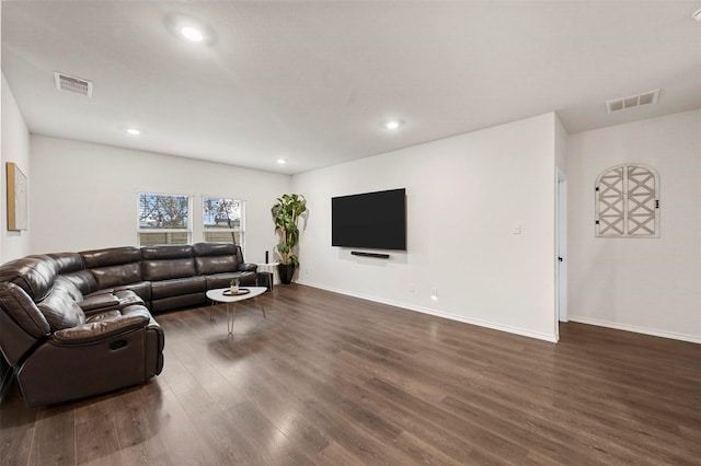 living room with dark hardwood / wood-style floors