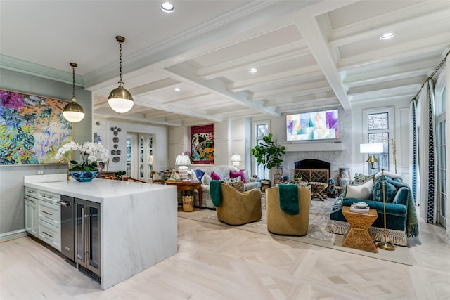 kitchen featuring light parquet floors, coffered ceiling, pendant lighting, and beamed ceiling